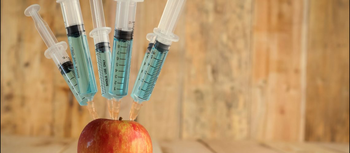 GMO Apple with injection needle